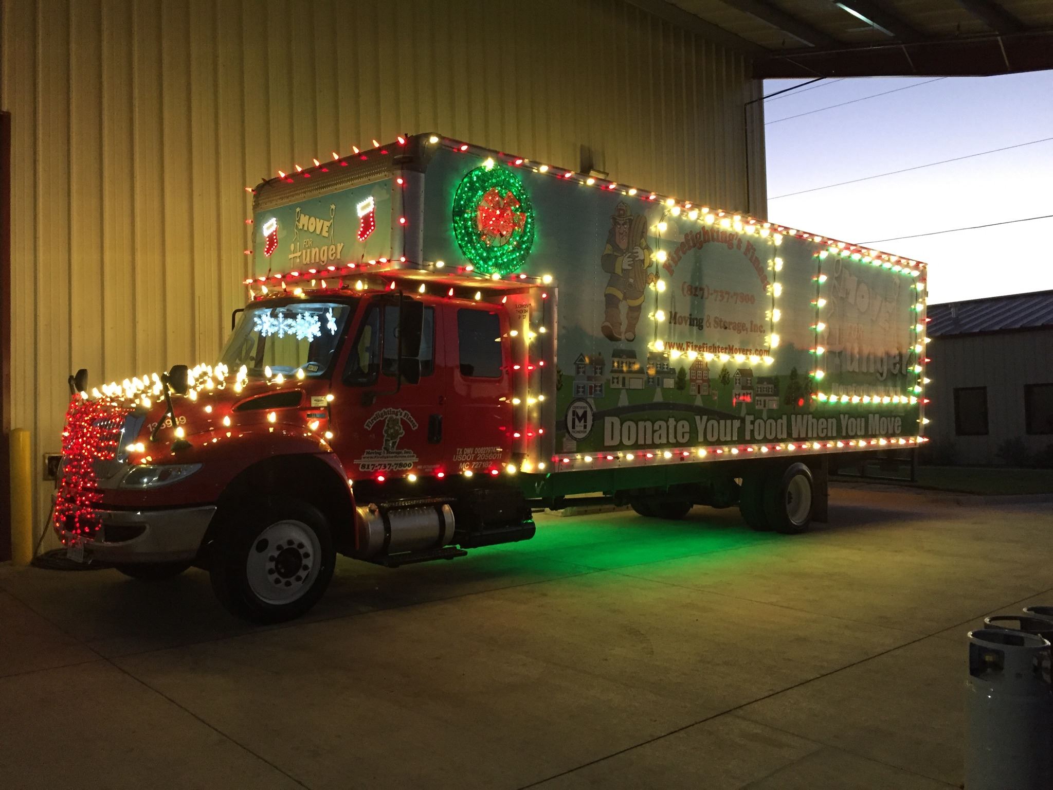 Truck of Firefighting's Finest Moving & Storage decorated during Christmas in Austin, TX