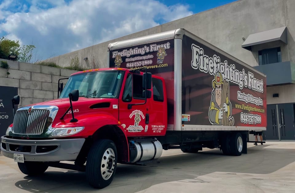 Firefighting's Finest Moving and Storage Company truck at warehouse