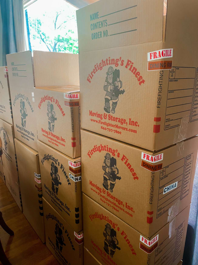 Firefighting’s Finest Moving & Storage neatly stacked cardboard boxes