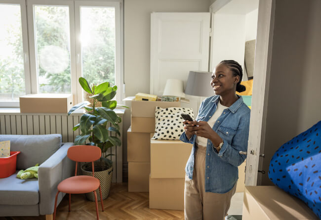 A person in their new Texas home after unpacking services from Firefighting’s Finest Moving & Storage