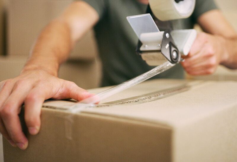 A person packing for a stress-free move in Texas