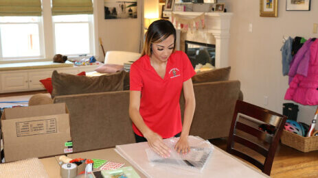 A Firefighting's Finest Moving and Storage employee helping with packing services in Texas