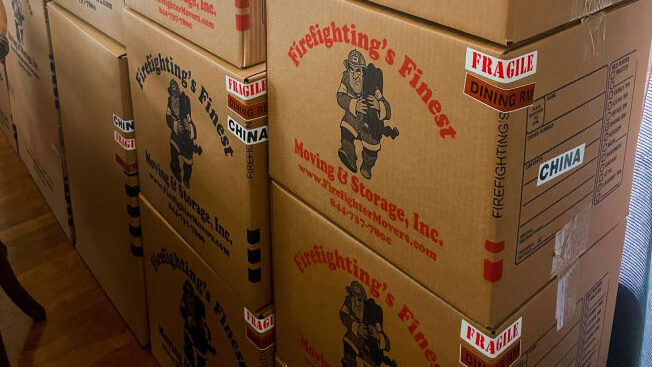 Firefighting’s Finest Moving & Storage neatly stacked cardboard boxes
